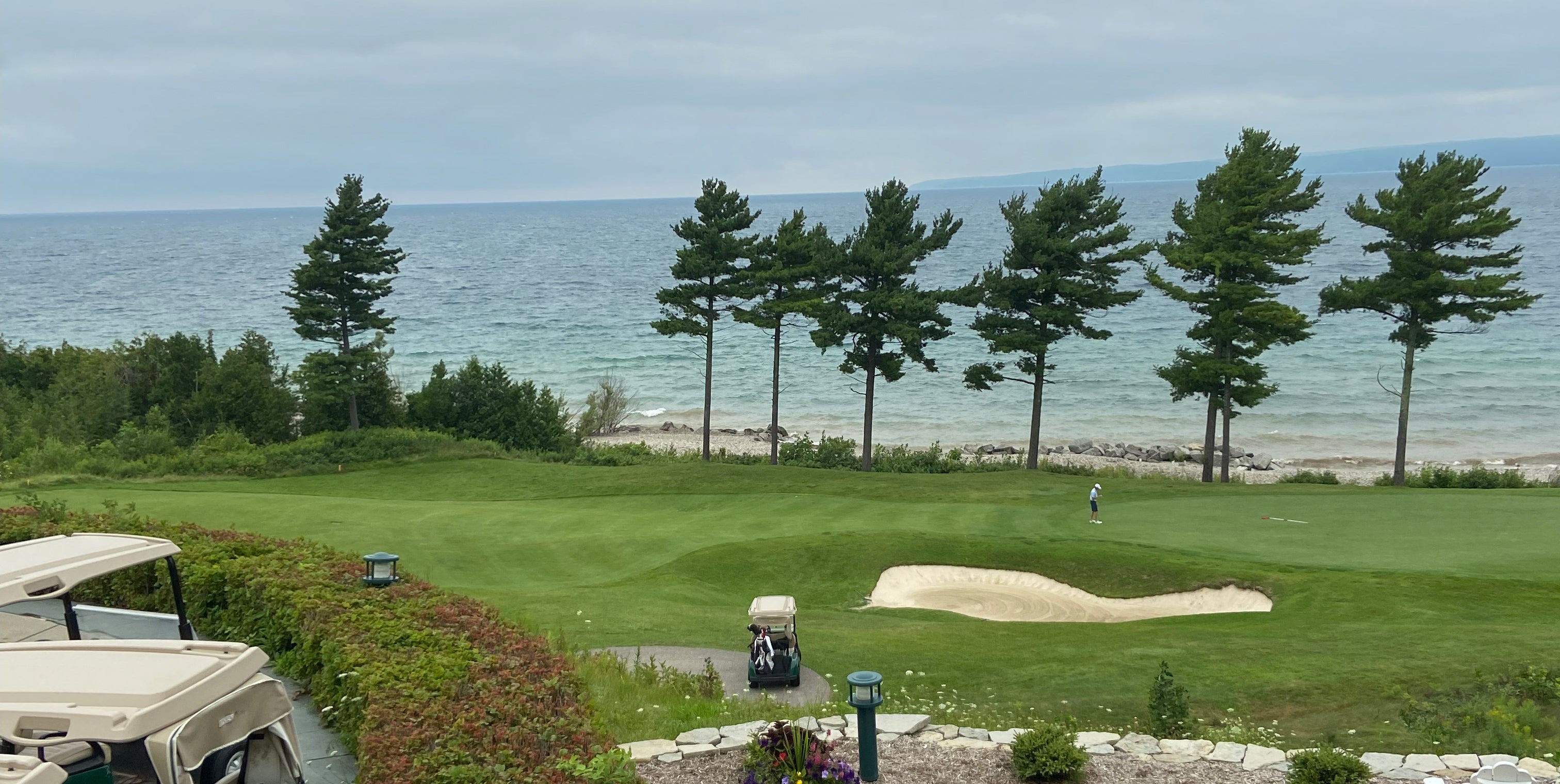 golf hole against water